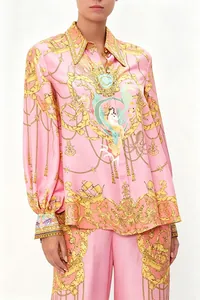 Detail view of pink silk-like shirt set with nautical baroque golden prints