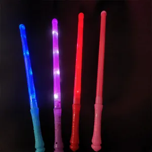 Set of four-color LED glow sticks for concerts and parties on a black background
