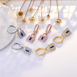 Elegant padlock hoop earrings with crystals and blue stones in gold, silver, and rose gold