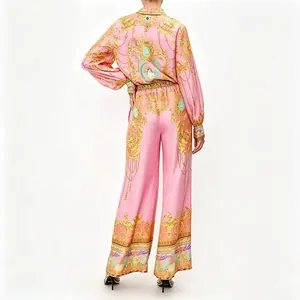 Back view detail of women's macaron pink baroque print shirt and wide-leg trousers set