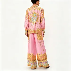 Detailed back view of a pink baroque print long-sleeve shirt and wide-leg trousers set.