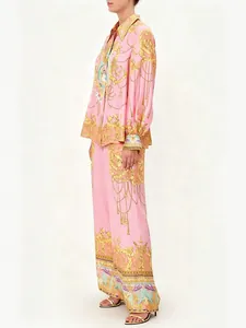 Elegant macaron pink long-sleeve shirt and wide-leg pants set with baroque print.