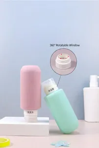 Detail of travel silicone bottle featuring a 360-degree rotatable label window for shampoo.