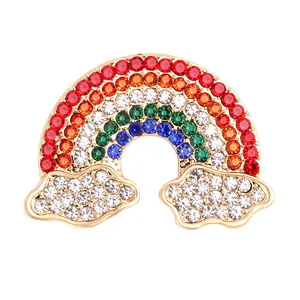 Vibrant rainbow and clouds brooch encrusted with colorful sparkling rhinestones on white