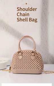 Detailed close-up of a mini pearl-textured PVC jelly shell bag with elegant gold chain strap