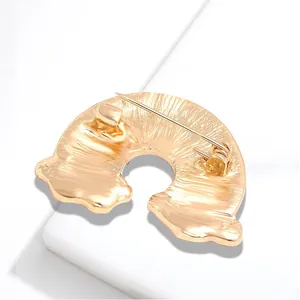 Back view of a gold-finish rainbow cloud brooch pin with a secure safety clasp