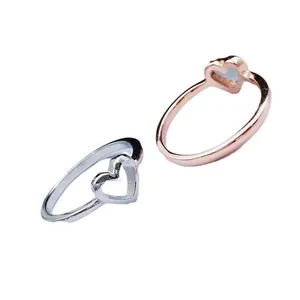 Minimalist heart-shaped electroplated alloy rings available in silver and rose gold finishes