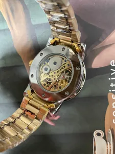 Detail view of luxury men's mechanical watch with transparent skeleton movement back