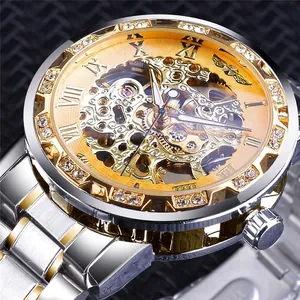 Detailed macro view of gold skeleton mechanical watch with rhinestone bezel