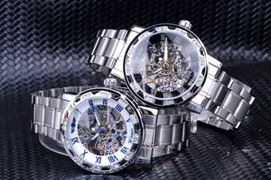 Detail of skeleton mechanical men's watches with diamond bezel and silver steel band.