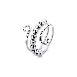Anillo multicapa de acero inoxidable plateado con cuentas giratorias para aliviar el estrés