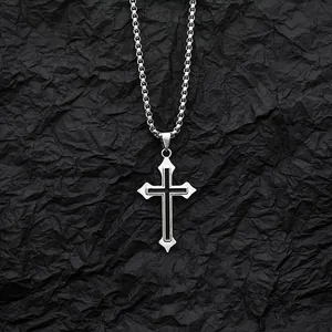Retro gothic cross pendant necklace with black inlay on a textured black background.