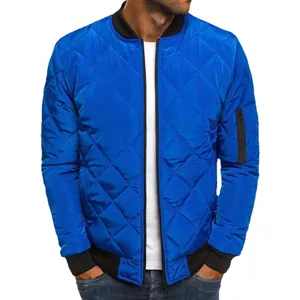 Bright blue men's quilted winter bomber jacket featuring a stand collar and rib trim