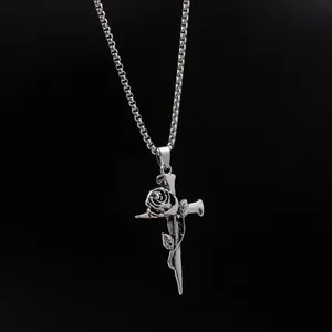Close-up of vintage silver rose and nail cross pendant necklace in gothic style