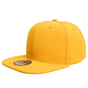 Close-up of a vibrant yellow hip-hop snapback hat with flat brim and logo sticker