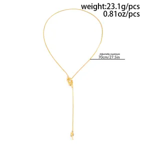 Detailed macro view of long gold tassel knot necklace with 70cm adjustable chain length