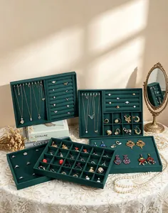 Professional dark green velvet jewelry display trays featuring various storage compartments