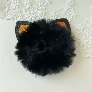 Close-up detail of Halloween black fluffy scrunchie with sparkling cat ears decoration
