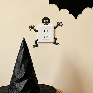 Spooky black skeleton monster wall sticker decorating a white light switch for Halloween.