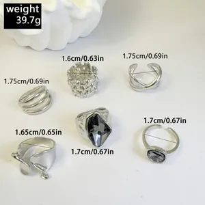Detailed view of six vintage silver rings set showing inner diameters and weight