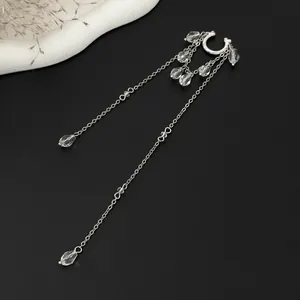 Detailed macro view of silver tassel ear cuff featuring elegant clear crystal bead accents.