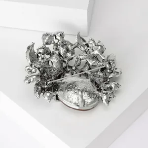 Vintage silver textured brooch back view with safety pin and pendant bail detail