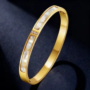 Elegant gold-plated titanium steel bangle featuring white shell inlay and three zircons