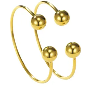 Minimalist gold-tone stainless steel open cuff bracelet with stylish double balls
