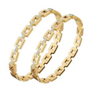 Luxurious gold-tone titanium steel square link bangles featuring rhinestone pave