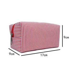 Red and white striped seersucker cosmetic bag showing detailed dimensions of 17x9x9cm