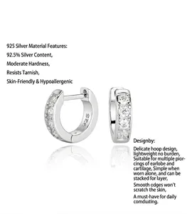 Detail view of S925 sterling silver huggie earrings with rows of sparkling zircon stones