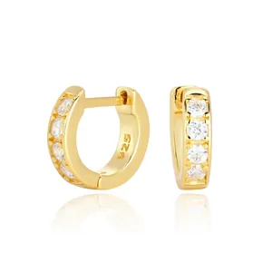 Detailed view of gold plated S925 sterling silver hoop earrings with clear stones
