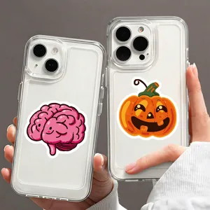 Close-up detail of cute cartoon brain and Halloween pumpkin stickers on clear phone cases