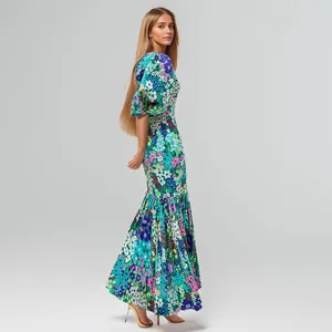 Elegant floral print maxi dress with puff sleeves and mermaid hem details.