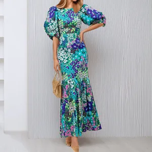 Full length view of a floral puff sleeve maxi dress with a slim silhouette and vibrant print