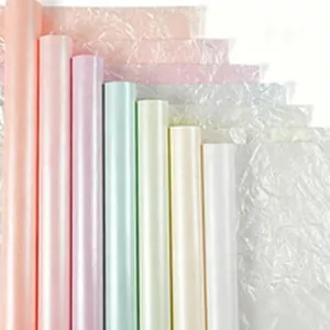 Assorted translucent pastel cellophane rolls for decorative floral bouquet wrapping.