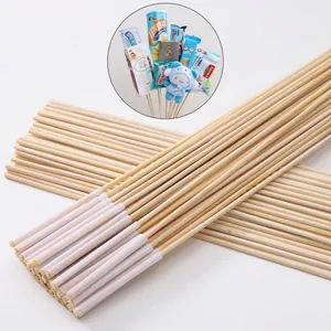 Detailed view of bamboo flower sticks with white sleeves for bouquet arrangements