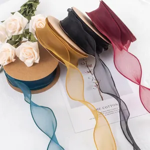 Detail view of multicolored sheer organza ribbons used for elegant floral gift wrapping