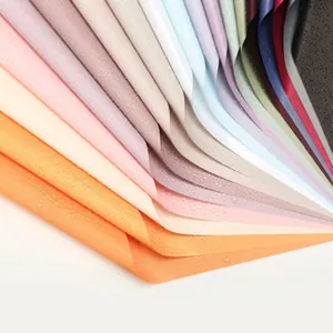 Detailed view of layered multi-colored flower wrapping paper with textured finish.