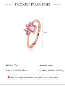 Detailed view of rose gold cat ring with pink heart stone and adjustable open band