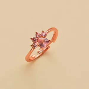 Rose gold cat paw adjustable open ring with pink heart gems and cute paw print design.