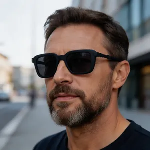 Detailed close-up of retro men's sunglasses featuring steampunk matte black square frames