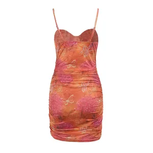 Back view of a sexy floral ruched bodycon dress with spaghetti straps and butterfly print