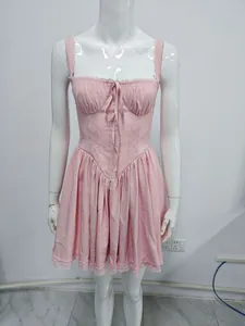 Full view of pink lace-up camisole dress with lace patchwork and A-line silhouette
