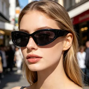 Detailed close-up of a woman wearing stylish black wrap-around sporty sunglasses outdoors.