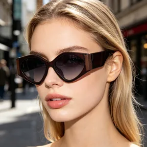 Close-up of model wearing trendy oversized geometric sunglasses with gradient lenses