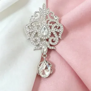 Elegant vintage silver crystal brooch with water-drop pendant and sparkling rhinestones
