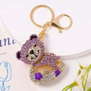 Portachiavi orsetto con strass viola e ciondolo cuore dorato con chiusura per borsette