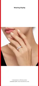 Close-up of a elegant moissanite row ring in 925 silver worn on a woman's finger