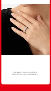Close-up detail of a moissanite eternity ring in 925 silver on a model's hand.